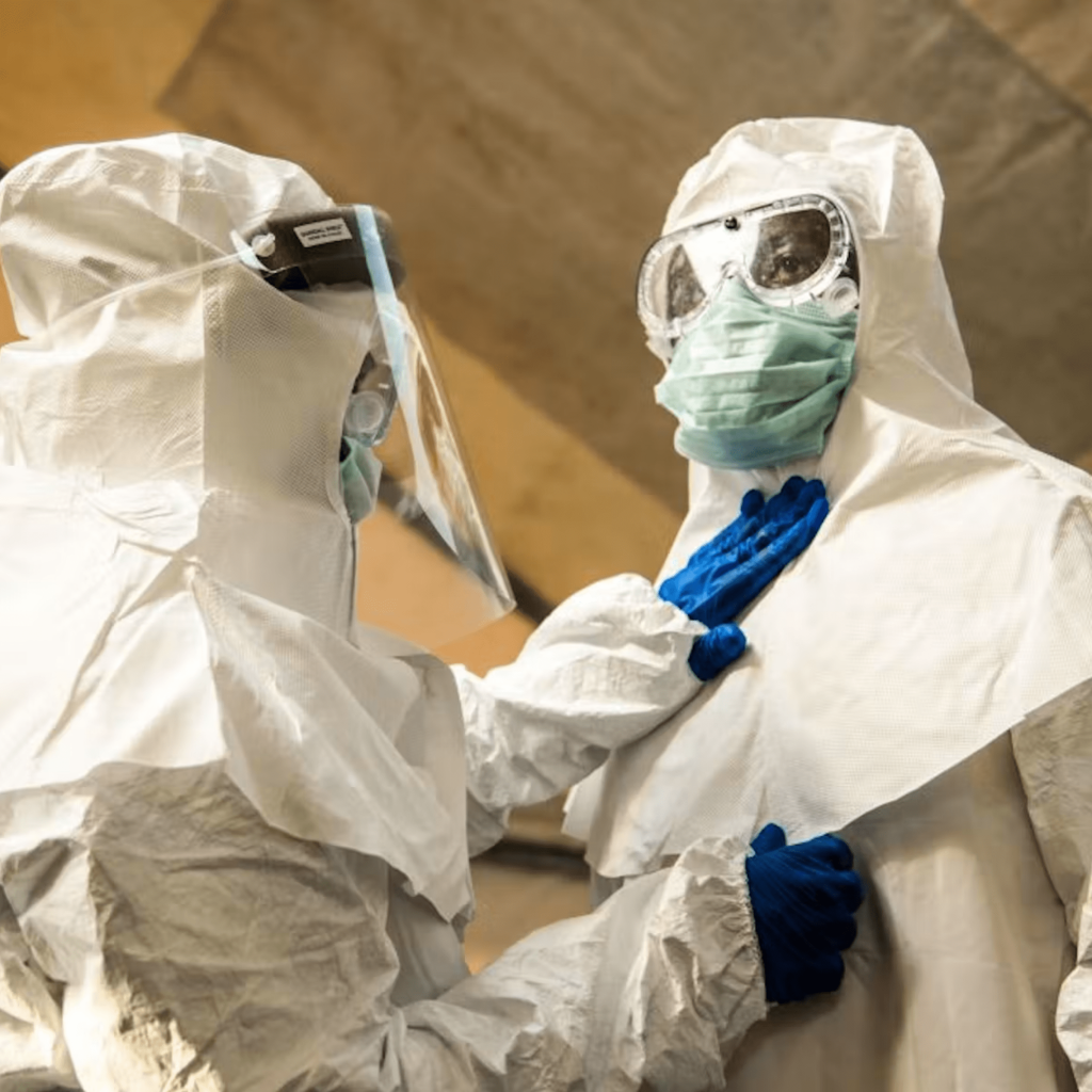 A medical worker wears PPE before entering the Ebola treatment ward